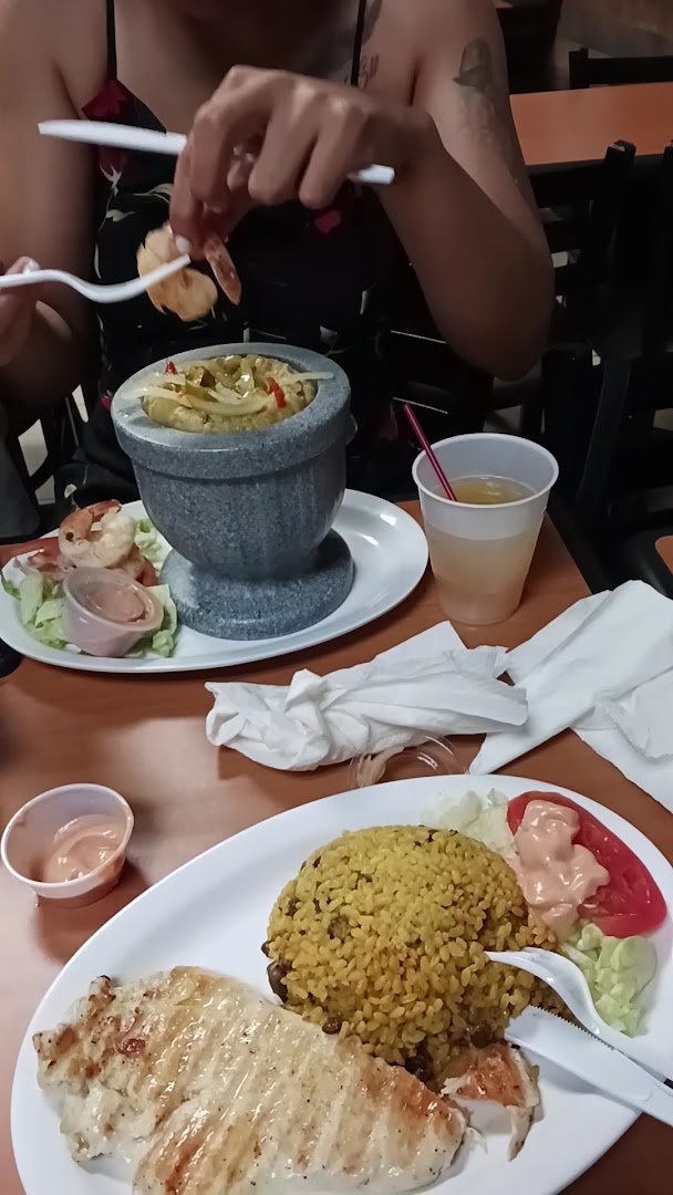 Plates of Puerto Rican food on a table.