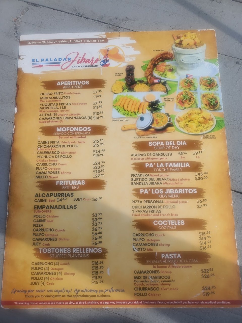 Printed menu showing pasta and signature dishes.